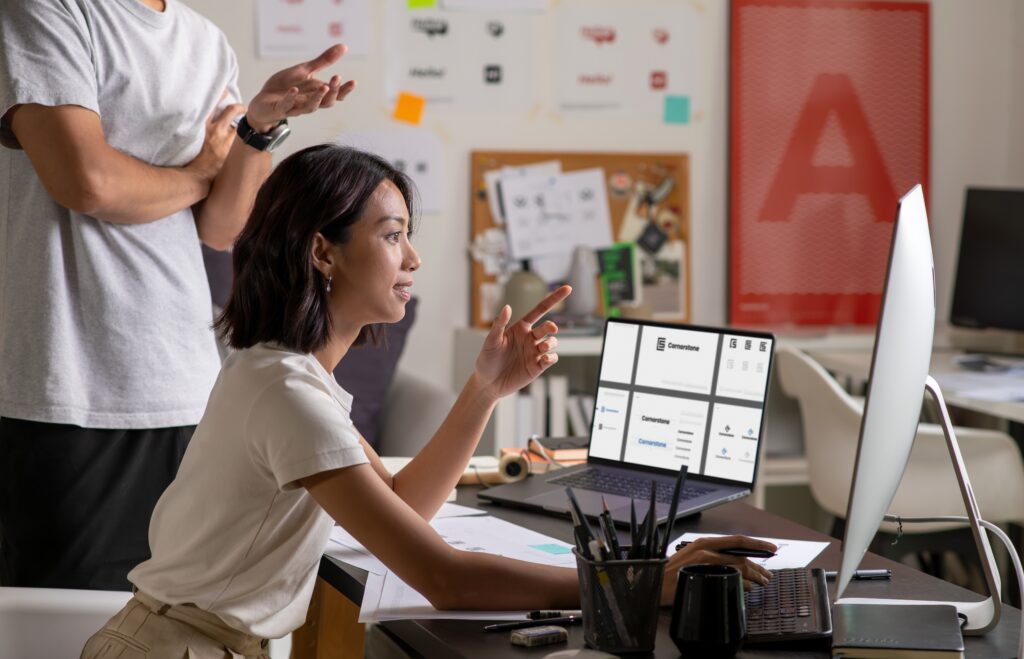 woman discussing marketing strategies to colleague