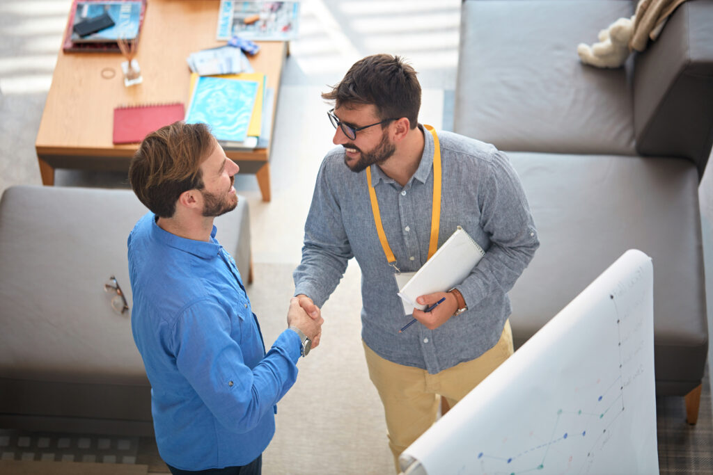 Direct Marketer shaking hands with a happy customer