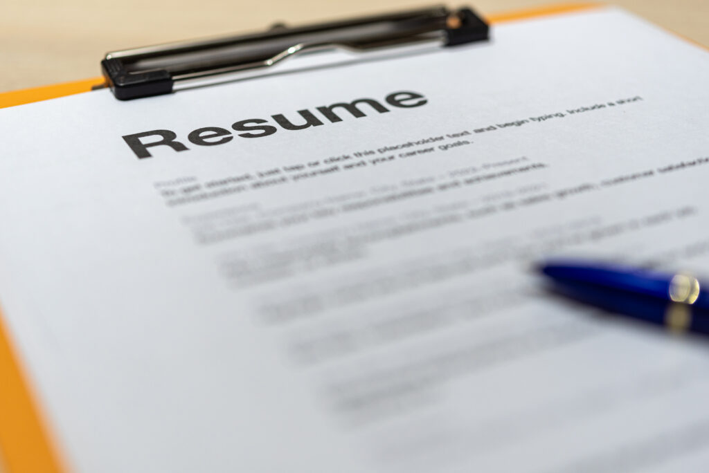 Close-up of a resume on a clipboard, illustrating how to make a resume with no experience.