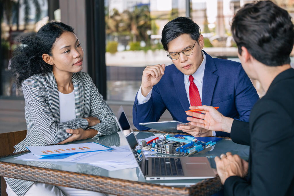 A team meeting with a business strategy consultant analyzing performance and outlining next steps.